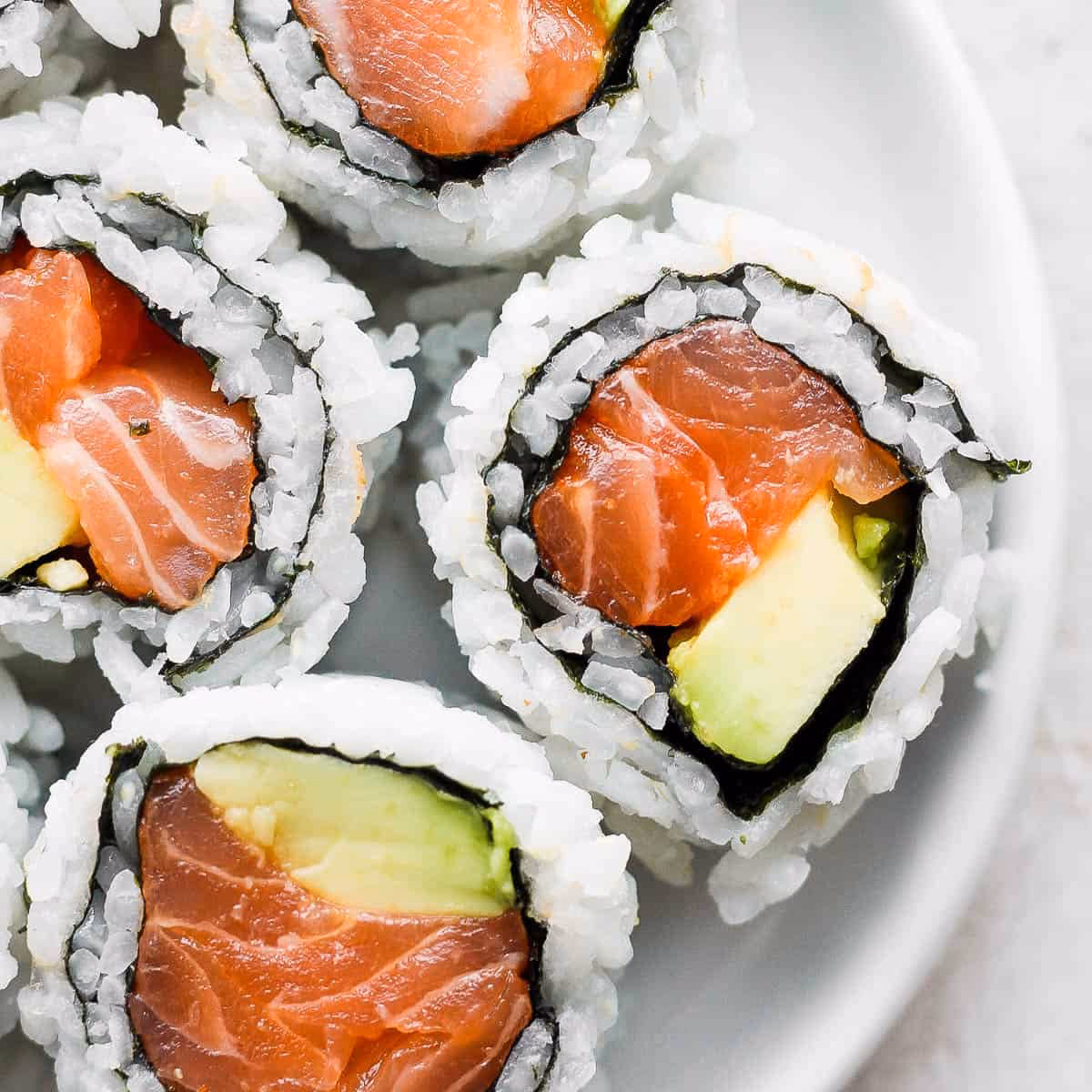 What are the names for sushi rolls with salmon?